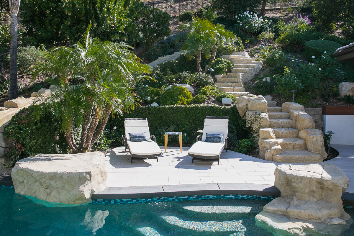 Two lounge chairs by the swimming pool